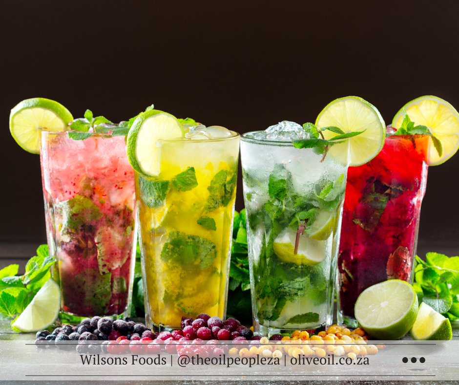 Recipes 5 Romantic Valentine's cocktails with fresh lime, strawberries, and mint garnish on an elegant bar setu