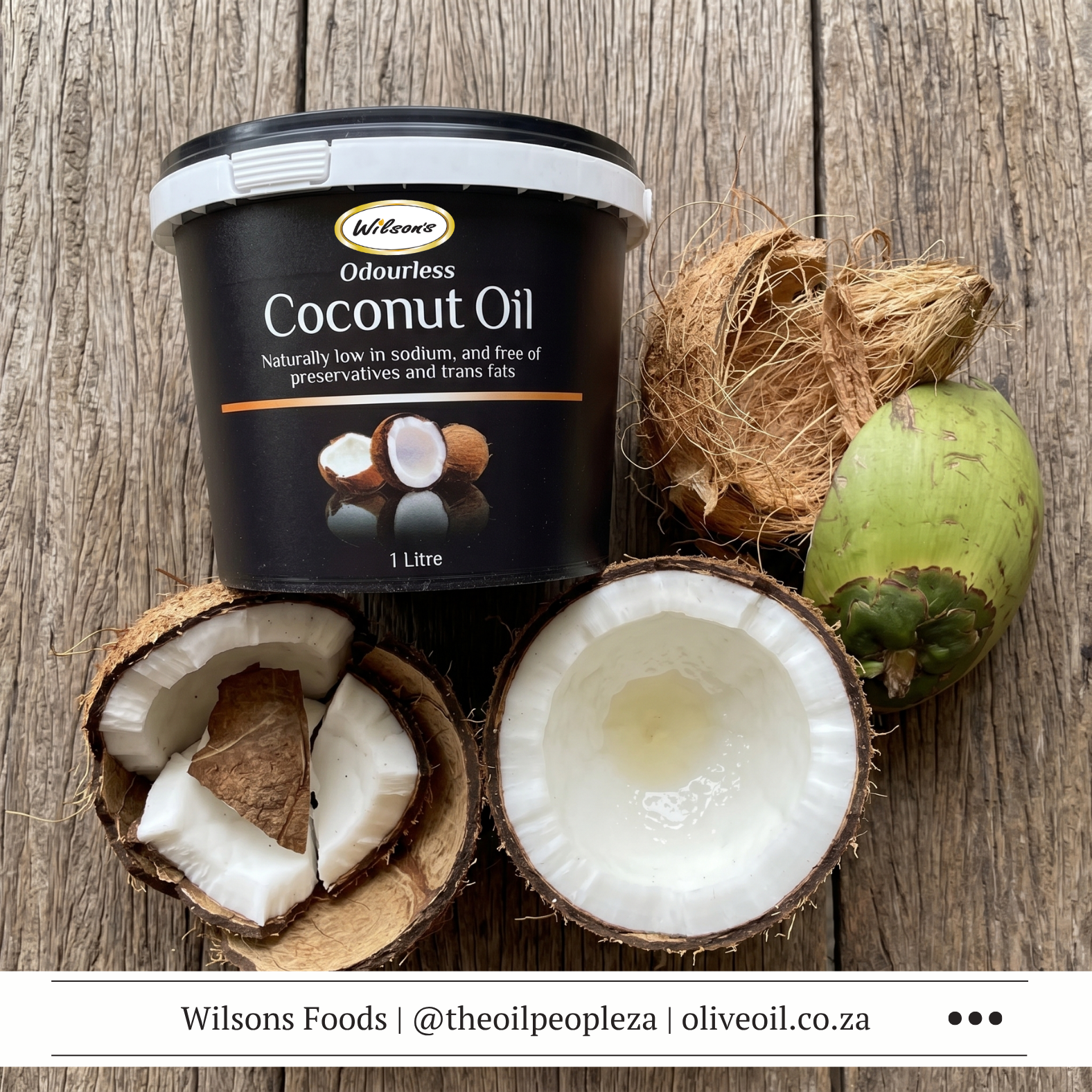 Articles 2 A jar of Wilson's coconut oil surrounded by halved coconuts and coconut shavings on a wooden surface