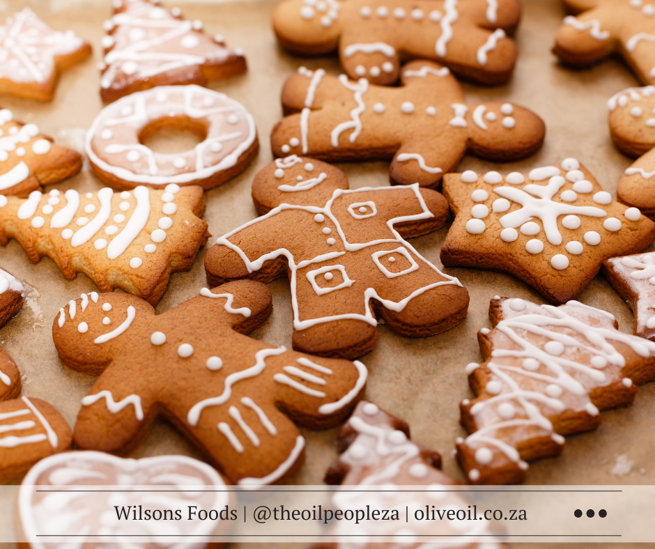 Soft homemade gingerbread cookies made with Extra Virgin Olive Oil, decorated for Christmas.