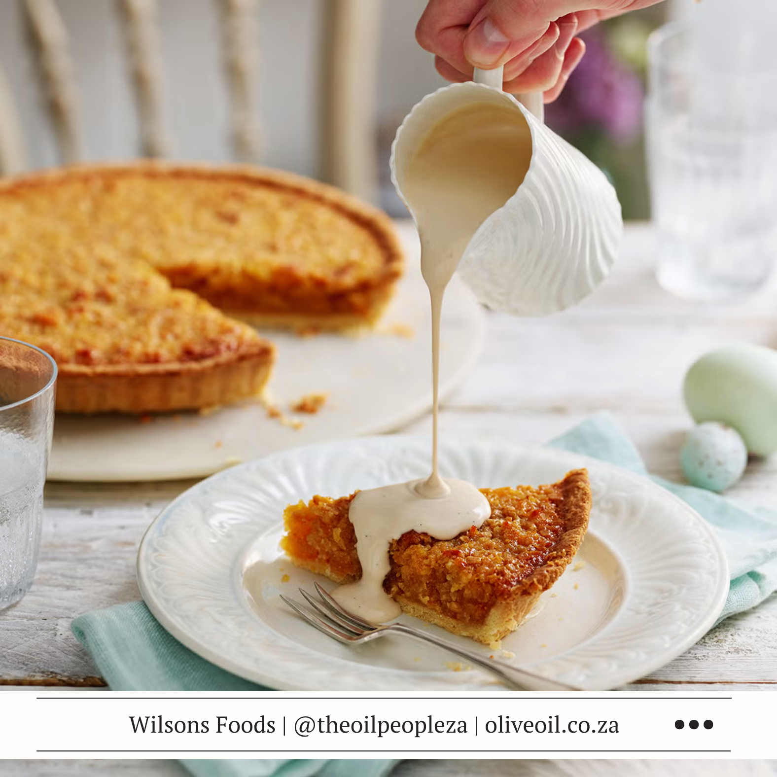 Homemade jam treacle tart with golden cornflake filling and rum custard for Mother's Day dessert