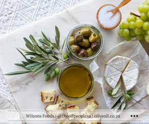 Marinated Mediterranean olives in a rustic bowl with herbs and olive oil