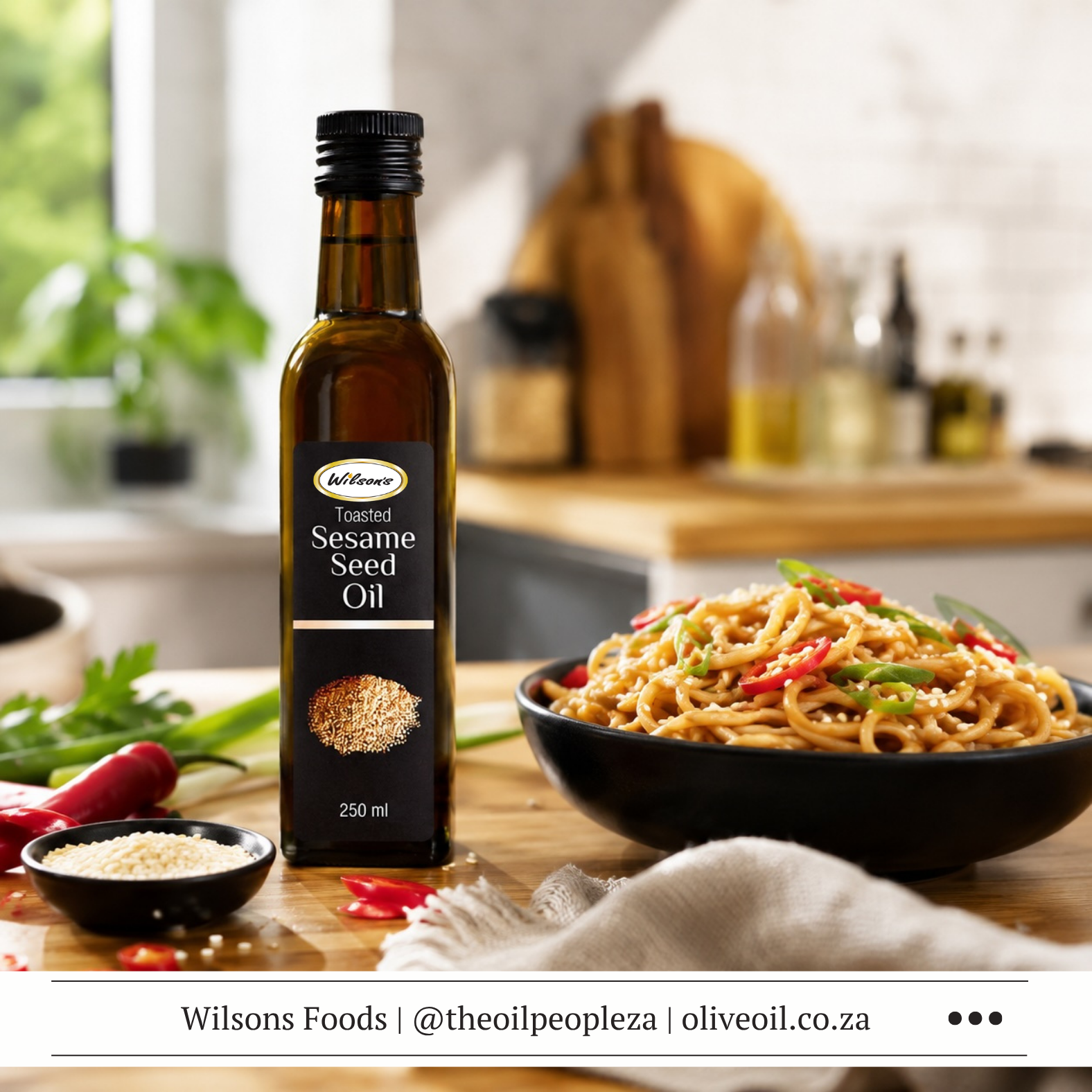 A bowl of cold sesame and chilli noodles made with Wilson's Foods Toasted Sesame Oil, topped with spring onions and sesame seeds
