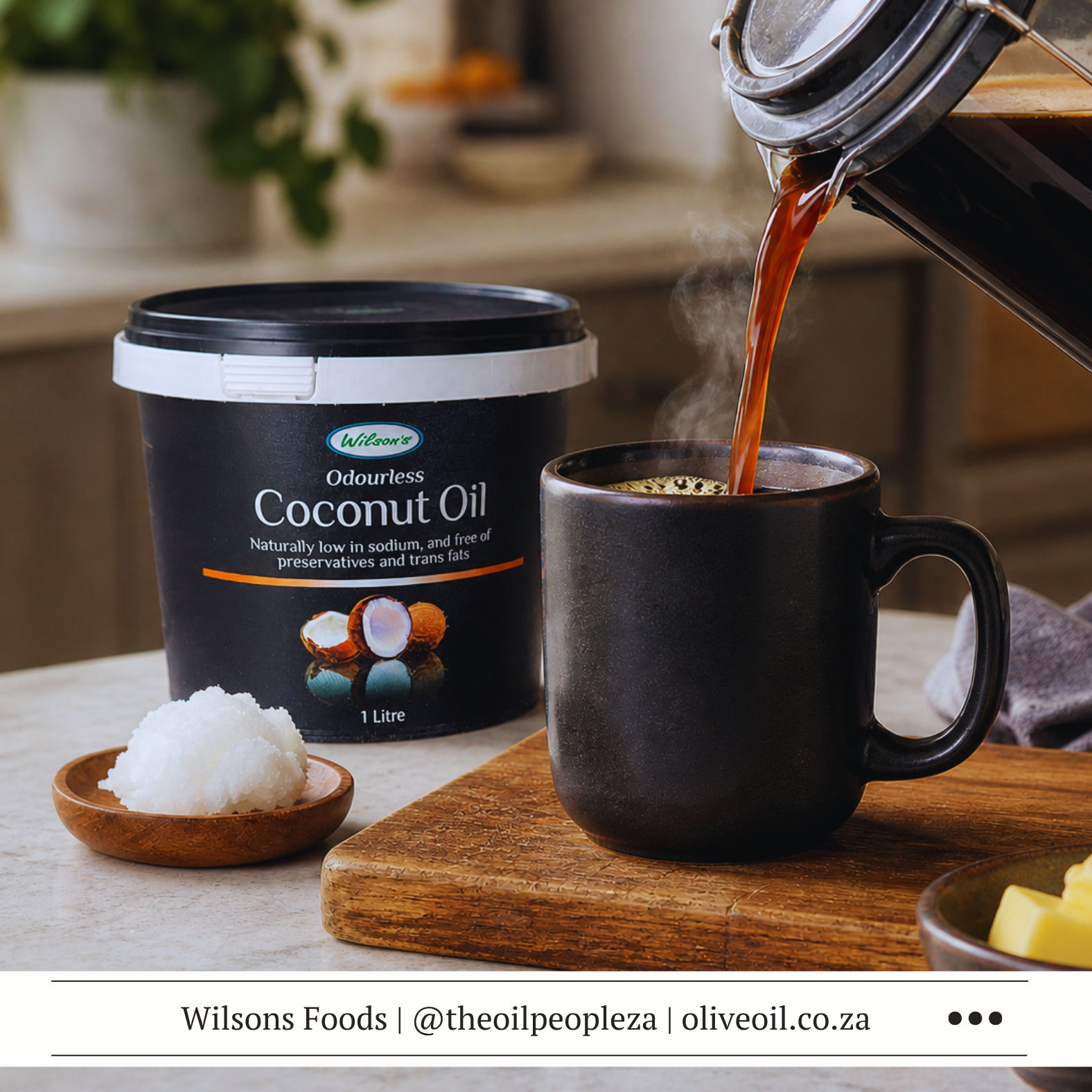 Frothy bulletproof coffee in a glass mug made with Wilson's Foods Coconut Oil and butter