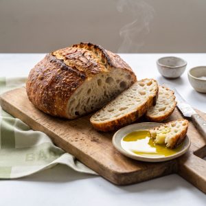 No-Knead Olive Oil Bread fresh from the pot, made with Wilson’s Extra Virgin Olive Oil