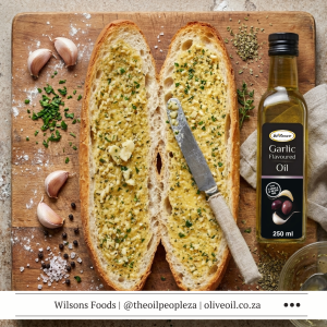 Vegan garlic bread sliced on foil made with Wilson's Foods Garlic Flavoured Oil and Peri-Peri Flavoured Oil